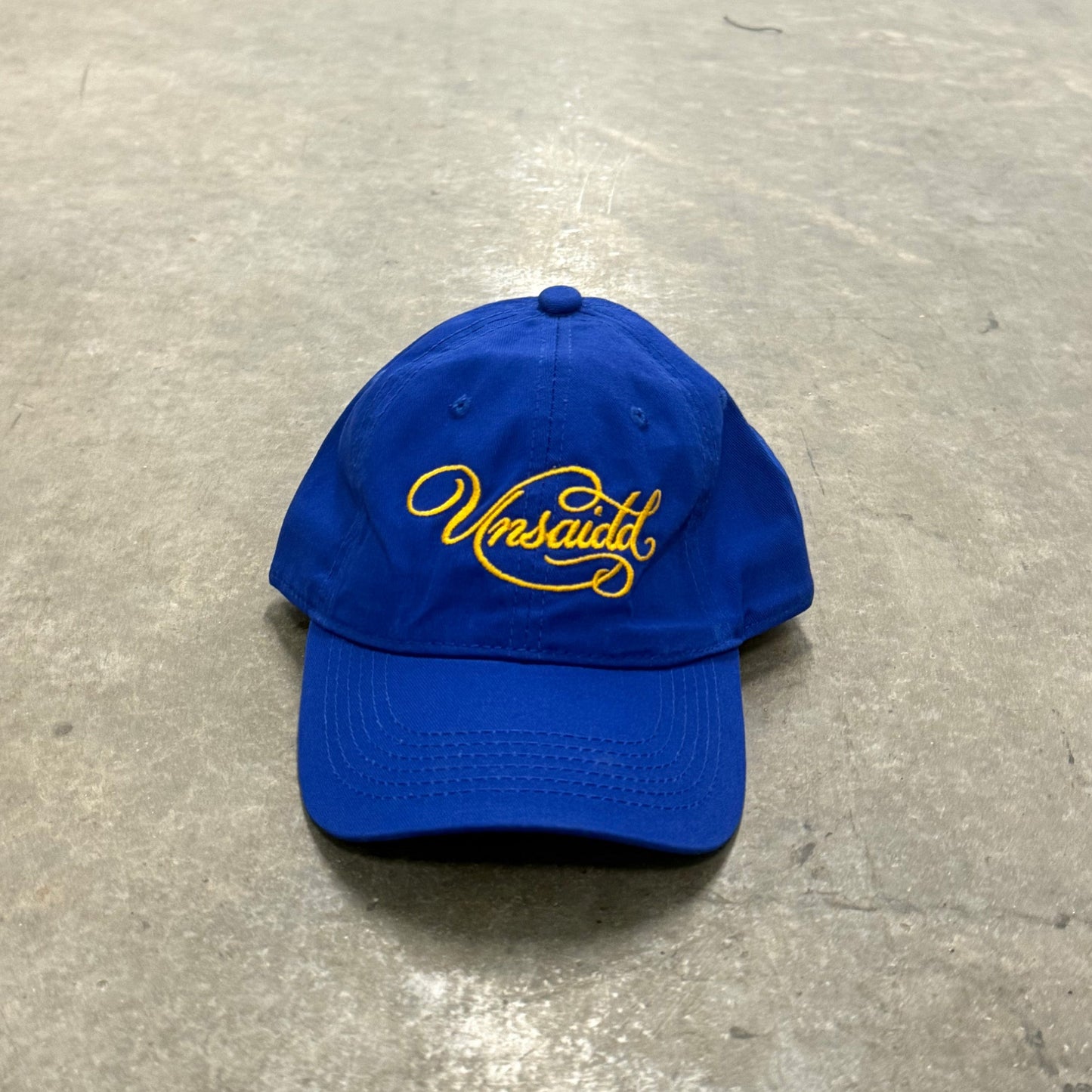 'UNSAIDD' Blue & Yellow Script Hat